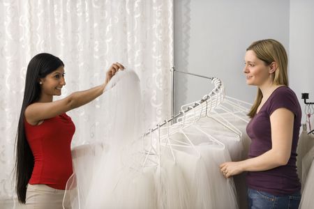 Indian woman and Caucasian woman shopping for veils.の写真素材