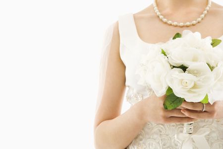 Close up shot of an Asian bride holding bouquet.の写真素材