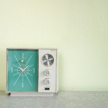Still life of vintage clock radio with turquois face.の写真素材