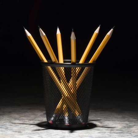 Group of pencils in a wire mesh pencil holder.の写真素材