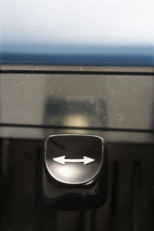 Close up of arrow type lever on typewriter.