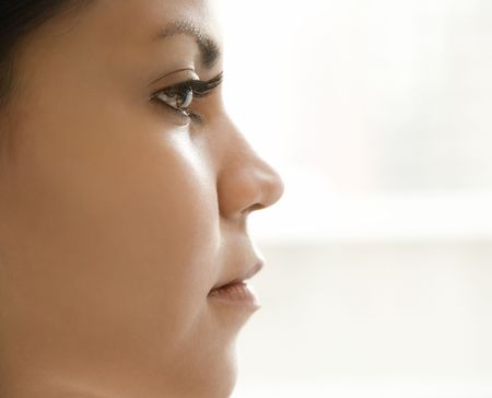 Close up profile of Hispanic young adult womans face.の写真素材