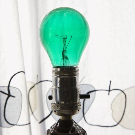 Close up of green light bulb in lamp.の写真素材