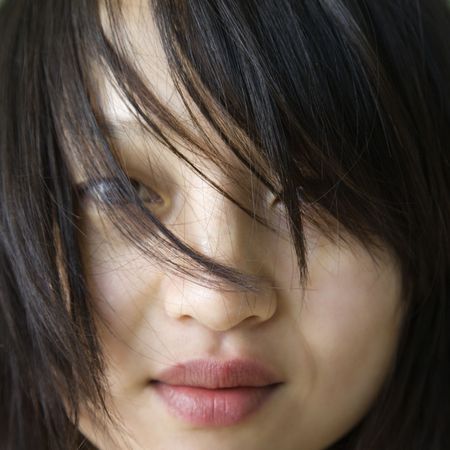 Close up portrait of pretty young Asian woman.