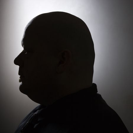 Caucasian mid adult bald man silhouette.の写真素材