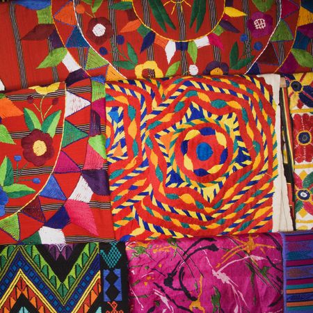 Close up of colorful tapestries.