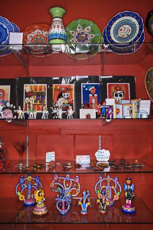 Shelves of unique folk art in retail store.の写真素材
