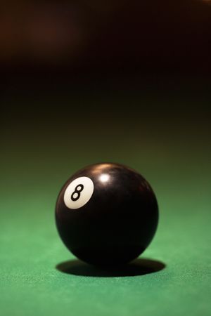 Eight ball on green billiards table.の写真素材