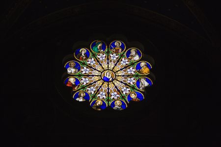 Religious themed stained glass window in Rome, Italy.