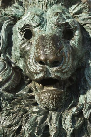 Close-up of bronze lion statue turning green from oxidation in Venice, Italy.の写真素材