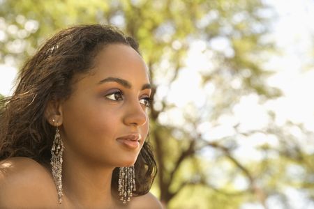 Young-adult African American woman looking to the side.の写真素材