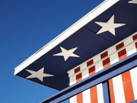 Close-up of lifeguard tower painted red, white and blue with stars and stripes in Miami, Florida,...