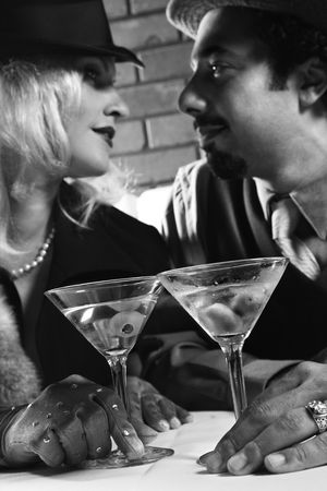 Caucasian prime adult retro male and female looking into eachother's eyes.の写真素材