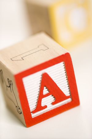 Selective focus of alphabet blocks with letter A in foreground.の写真素材