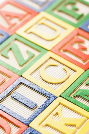 Alphabet toy blocks neatly arranged.
