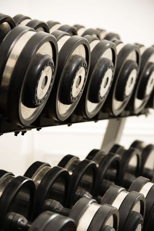 Rack of hand weights on rack.の写真素材