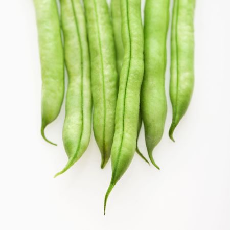 Close up of green beans on white background.の写真素材