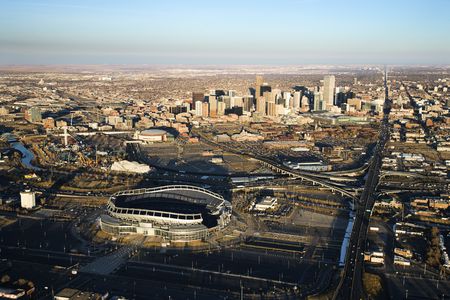 Aerial cityscape of urban Denver, Colorado, with Mile High stadium in foreground.の写真素材