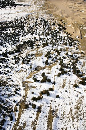 Aerial landscape of snowy plains in Great Sand Dunes National Park, Colorado.の写真素材