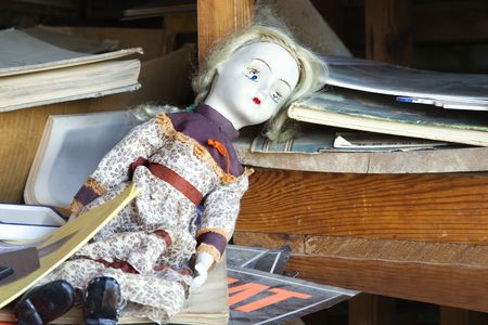 Old  doll sitting on shelf.の写真素材