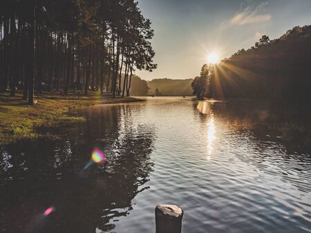 The sunrise and fog on the surface of the Pang Ung reservoir in Mae Hong Son province of Thailandの写真素材