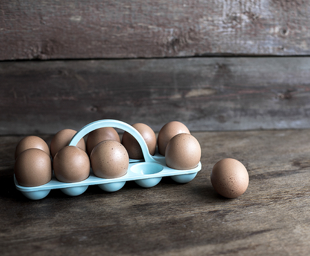 Chicken eggs on a wooden background