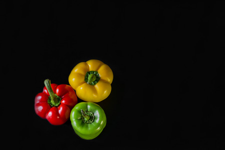 Peppers on a black backgroundの写真素材