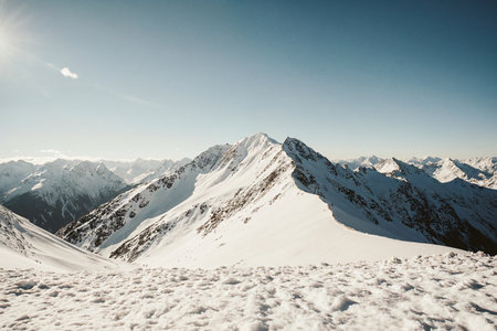 Winter mountains panorama with snow and clear blue sky. Caucasus Mountains, Georgia, Gudauri region.の素材