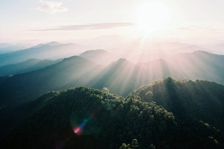 Mountain and sun ray at Doi Pha Tang in Chiangrai, Thailand.の素材