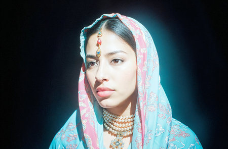 Portrait of a beautiful young asian woman wearing traditional indian clothingの素材