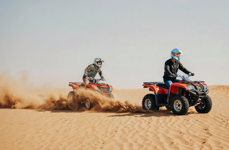 Racing on quad bikes in the desert of Dubai, UAE.の素材