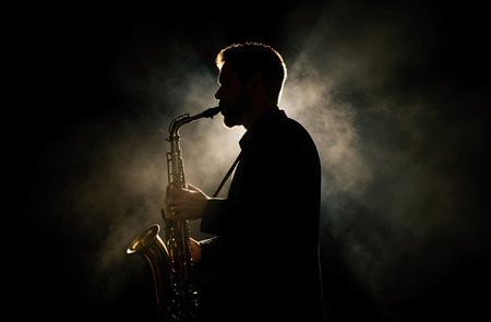 Saxophonist playing on saxophone on dark toned foggy backgroundの素材