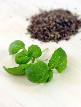 Fresh basil herb leaves on a wooden board の写真素材