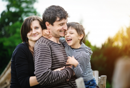 Happy family in a parkの写真素材