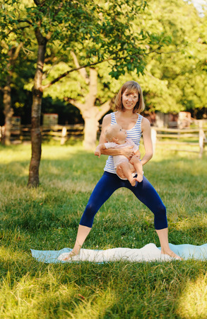 Mother and her daugther practice yogaの写真素材