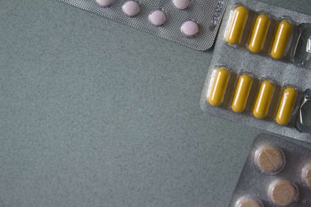 corner frameof medicines on gray background . High quality photoの写真素材