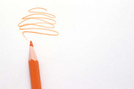 orange pencil with scroll on white background. High quality photo