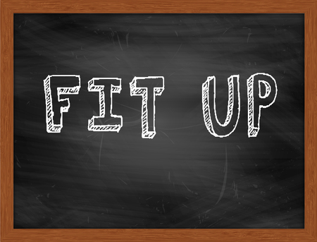 FIT UP  hand writing text on black chalkboardの写真素材