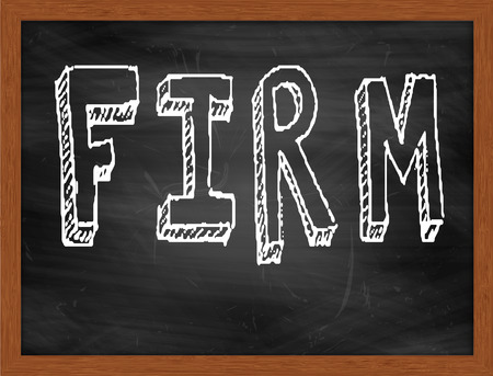 FIRM  hand writing text on black chalkboardの写真素材
