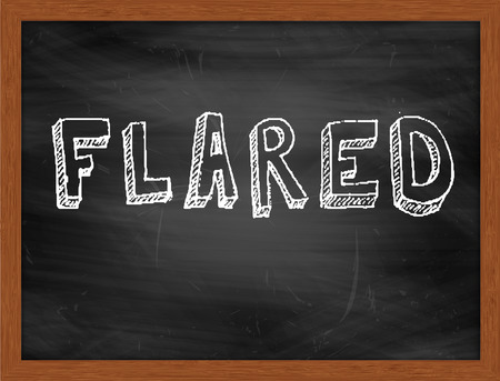 FLARED  hand writing text on black chalkboardの写真素材