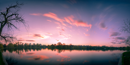 Long exposure panorama with clouds in the spring in the Titan Park, Bucharest, Romaniaの写真素材