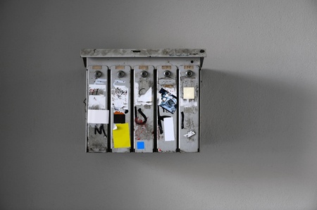 Grungy lockboxes with empty sheets of paper for filling it with creative contentの写真素材