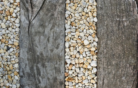 Pebbles between old wooden railway sleepers - interior of a saunaの写真素材