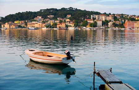 Boat in the mediterranean harbour of mali losinj, croatiaの写真素材