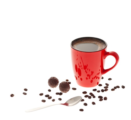 Red cup of coffee, coffee beans, chocolate and spoon isolated on white backgroundの写真素材
