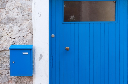 Detail of a blue mediterranean door with letterboxの写真素材