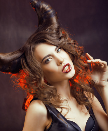 bright mysterious woman with horn hair, halloween celebrationの写真素材