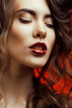 Beauty Woman with Perfect Makeup Beautiful Professional Holiday Make-up  Red Lips and Nails Beauty Girls Face isolatedの写真素材