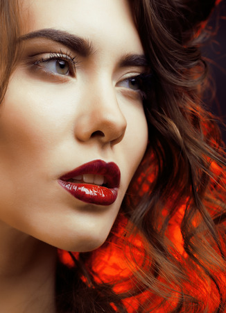 Beauty Woman with Perfect Makeup Beautiful Professional Holiday Make-up  Red Lips and Nails Beauty Girls Face isolated on Black background Glamorous Womanの写真素材
