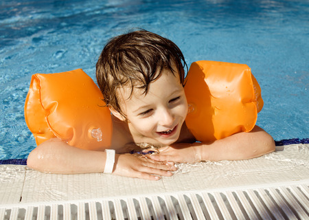 little cute boy in swimming pool close upの写真素材